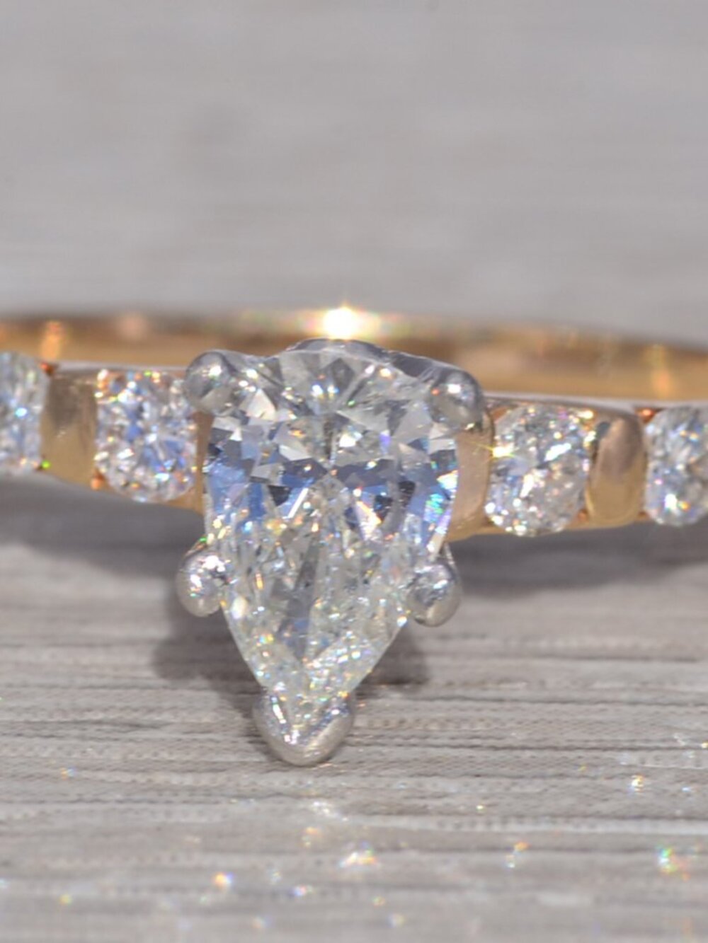 Natural Pear Cut Diamond Engagement Ring with Accent Diamonds in Yellow Gold